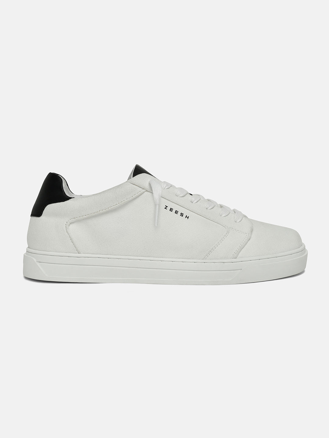 ZEESH Chalk Line sneakers – clean white denim with black leather accents, orthopaedic insole & durable TPR sole. Minimalism redefined.